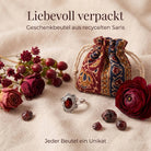 [KI] Silberring mit Granat und Geschenkbeutel aus recyceltem Sari