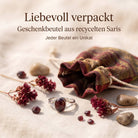 [KI] Silberring mit Granat und Geschenkbeutel aus recyceltem Sari