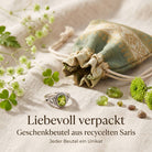 [KI] Silberring mit Peridot und Geschenkbeutel aus recyceltem Sari