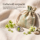 [KI] Silberring mit Peridot und Geschenkbeutel aus recyceltem Sari