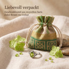 [KI] Silberring mit Peridot und Geschenkbeutel aus recyceltem Sari